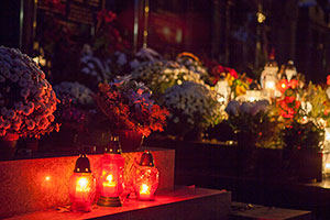 Candles, Wreaths and Flowers on Graves on All Souls' Day